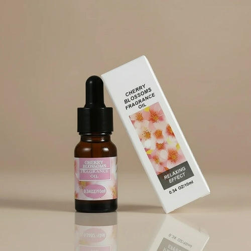 Cherry Blossoms fragrance oil bottle and packaging on a white background